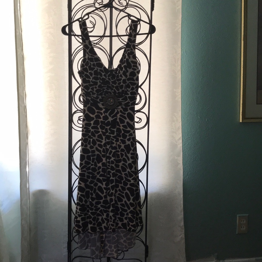 High/low sundress animal print. Ornament beading.